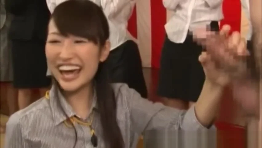 One oriental chick is picked to jerk cock on stage